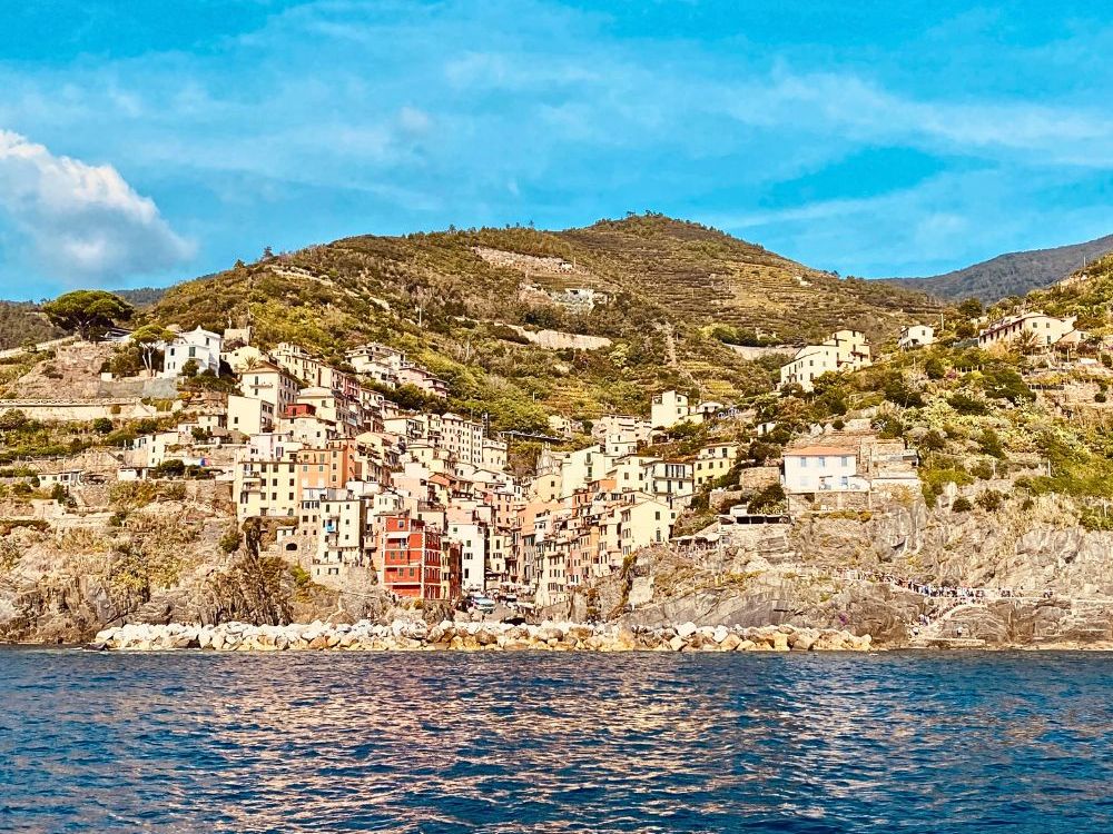 The town is in a cleft between cliffs so the houses climb steeply up on either side.