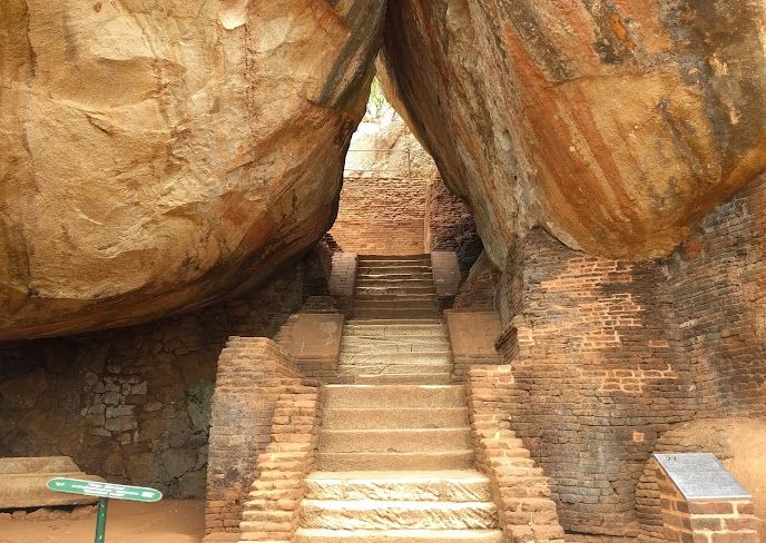 Stone stairway going between two huge boulders.