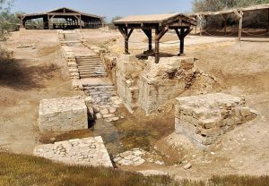 Stone steps down into a dry hole.