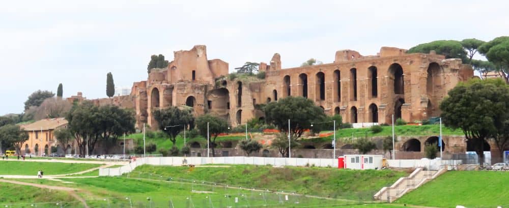 Tall ruins of what looks like red brick, with tall window or archway openings.
