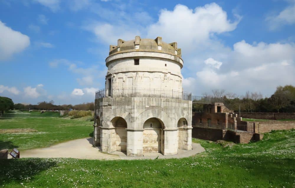 The white stone building is 10-sided, taller than it is wide.