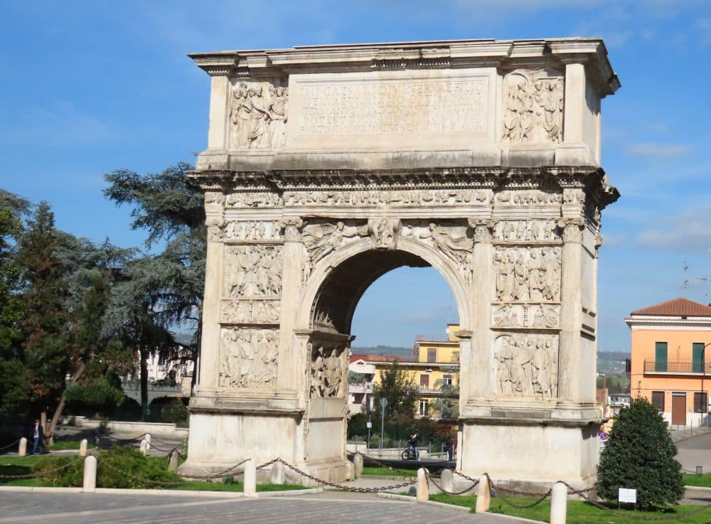 A large archway with bas-reliefs.
