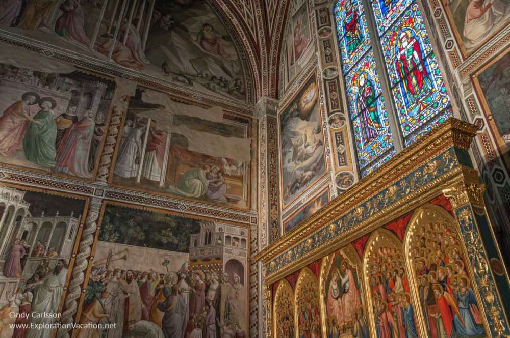 Very ornately and colorfully decorated walls and windows in just one corner of the church.