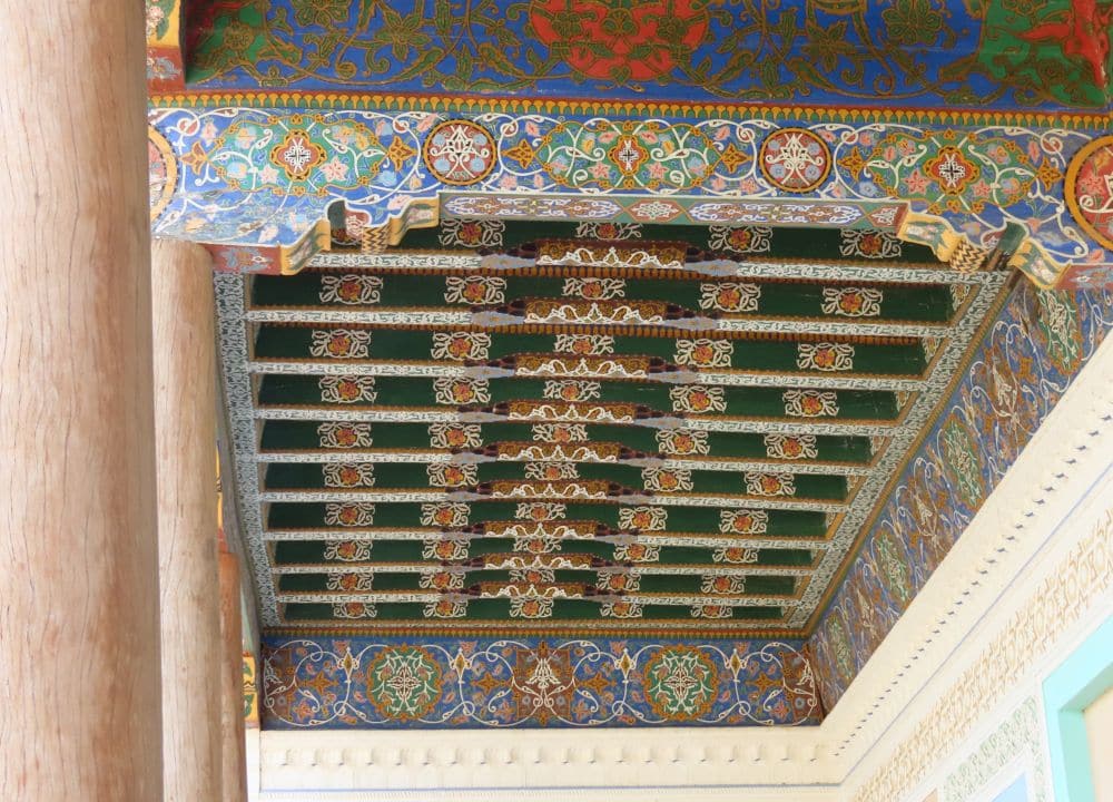 Beams across are painted very colorfully with floral patterns.